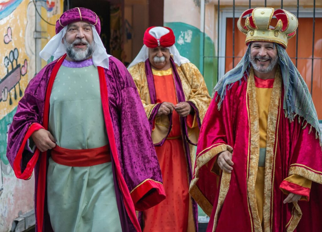 Three men dressed as the three magi for Día de los Reyes (Three Kings Day)