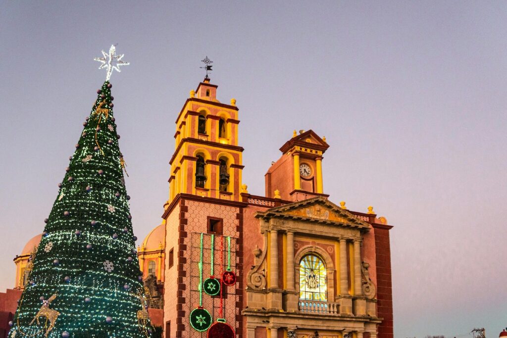 San Miguel Arcangel Church and Christmas Tree lit up for Las Posadas, a traditional Latin American celebration leading up to Christmas