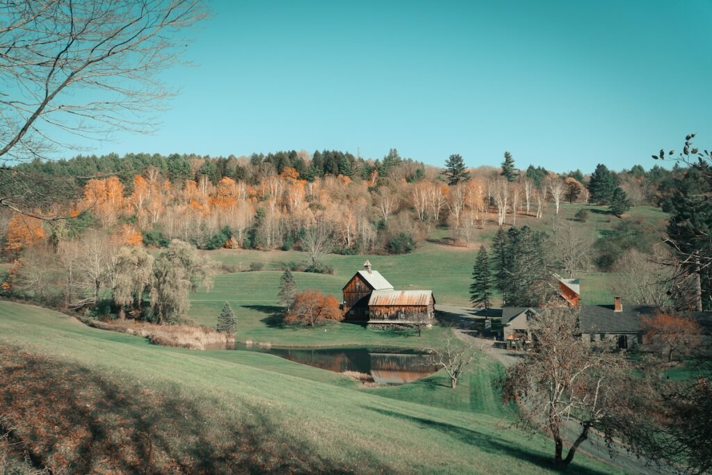 A landscape view with a farmhouse in Woodstock, Vermont