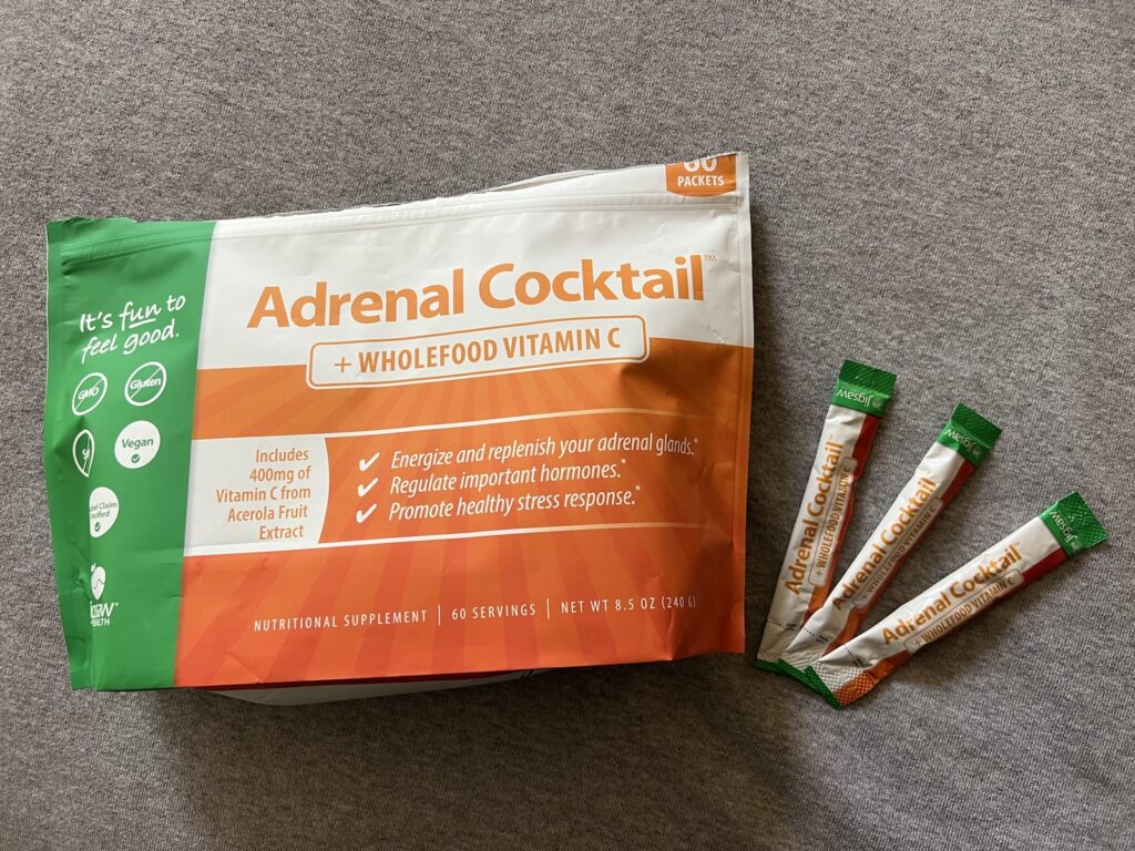 Bag of Jigsaw adrenal cocktail electrolyte packets with a few packets laid out beside it.