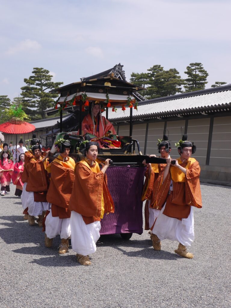 The Saio-dai and court women in traditional Heian-period dress during the Aoi Matsuri procession in Kyoto, Japan.